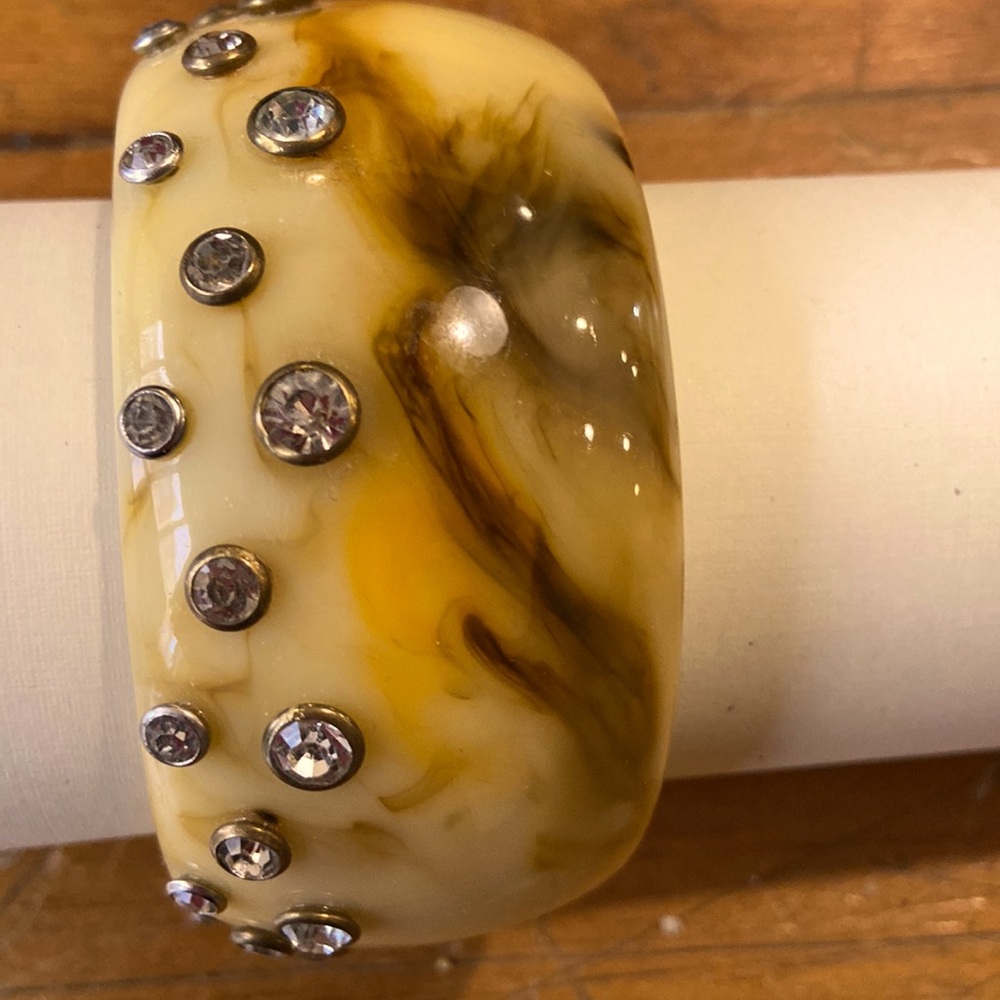 Resin bracelet with rhinestones.